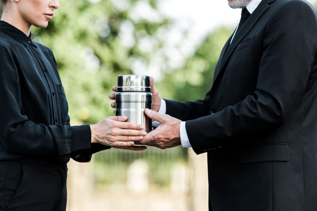 handing over the urn after the pre planned funeral