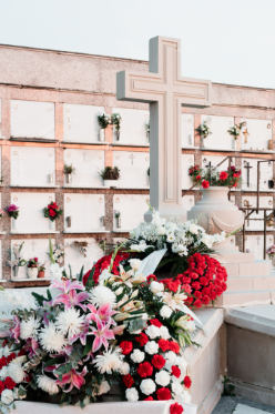 christian burial ground with flowers all around
